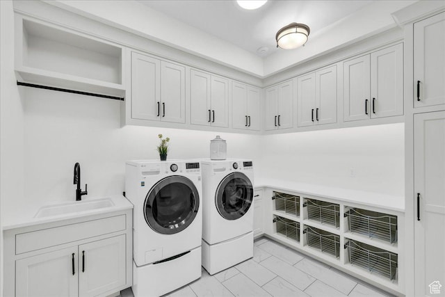 4009 S 2420 E, St George, UT 84790 - laundry room featuring washing machine and dryer, light marble finish floors, and cabinet space