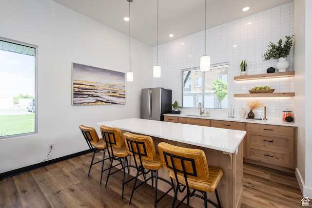 2303 E 830 S Unit 7, Spanish Fork, UT 84660 - kitchen featuring dark hardwood / wood-style floors, stainless steel fridge, a kitchen island, and decorative light fixtures
