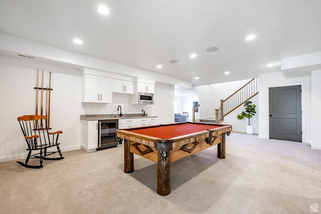 game room featuring pool table, sink, light carpet, and wine cooler
