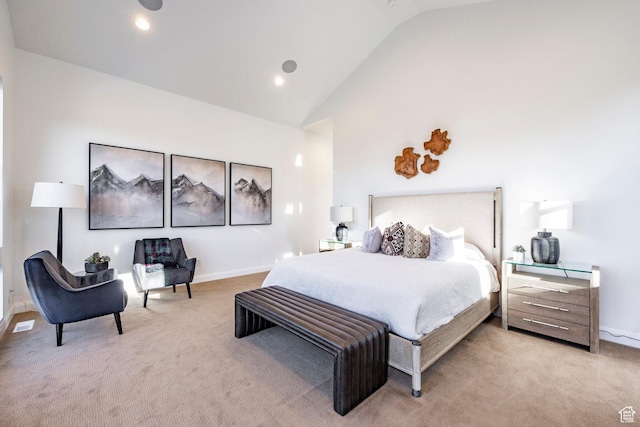 bedroom with light carpet and vaulted ceiling