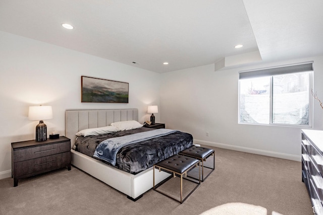 bedroom featuring light colored carpet
