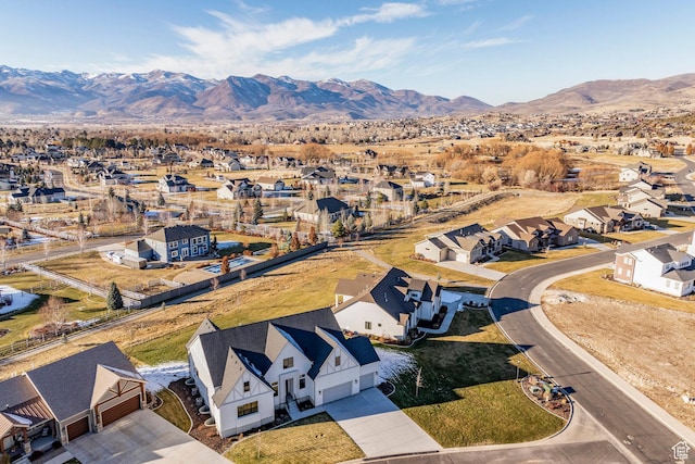 birds eye view of property with a mountain view