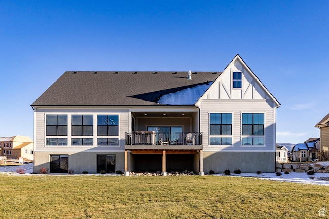 back of property with a lawn