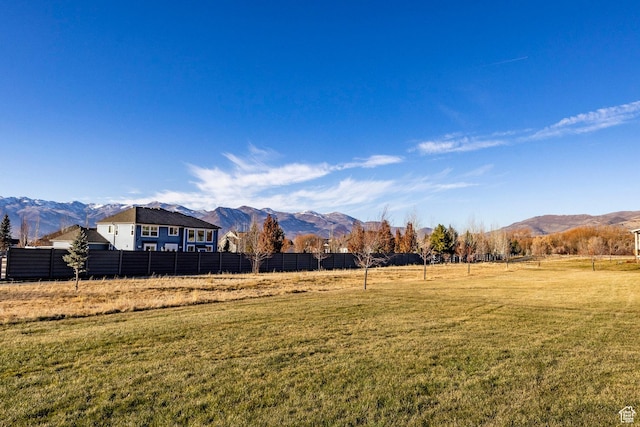 view of yard featuring a mountain view and a rural view