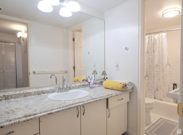 875 E Arrowhead Ln S Unit 42, Murray, UT 84107 - full bathroom featuring tile patterned floors, shower / bathtub combination with curtain, vanity, and toilet