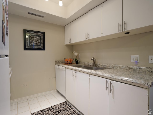 875 E Arrowhead Ln S Unit 42, Murray, UT 84107 - kitchen featuring white dishwasher, light countertops, white cabinetry, and light tile patterned floors