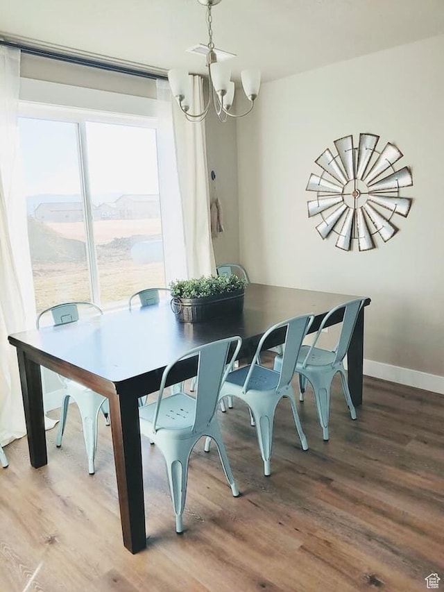 276 W Seasons Ln, Garden City, UT 84028 - dining room featuring a chandelier and wood finished floors