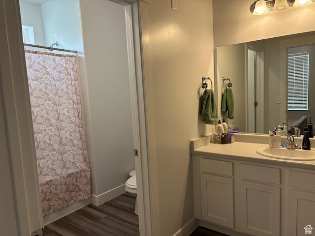 1772 W Terra Vista Ln Unit G101, Saratoga Springs, UT 84045 - bathroom featuring a shower with curtain, vanity, hardwood / wood-style flooring, and toilet