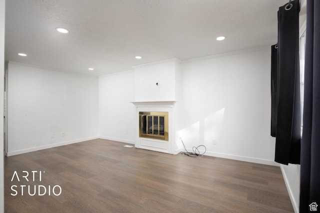 4748 S 700 E Unit 97, Murray, UT 84107 - unfurnished living room with ornamental molding, recessed lighting, wood finished floors, a glass covered fireplace, and baseboards