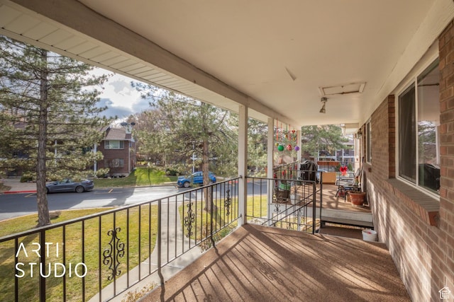 4748 S 700 E Unit 97, Murray, UT 84107 - wooden terrace with a porch and a lawn