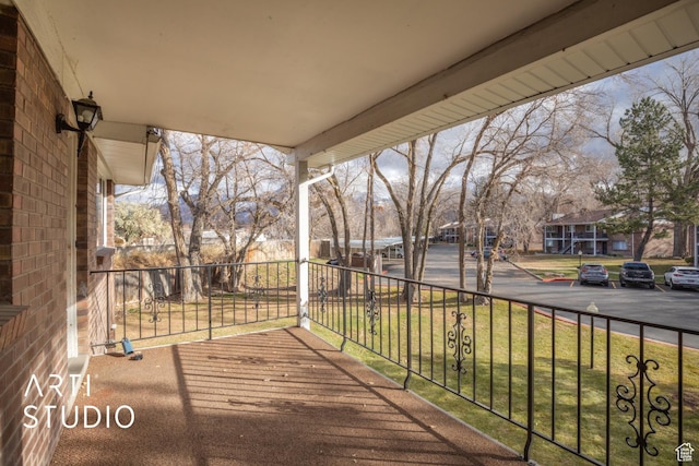 4748 S 700 E Unit 97, Murray, UT 84107 - wooden deck with a porch, a residential view, and a yard