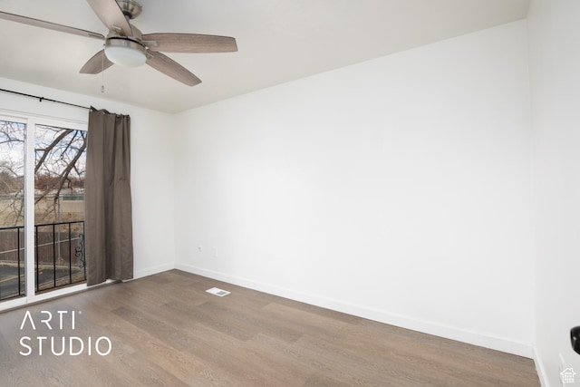 4748 S 700 E Unit 97, Murray, UT 84107 - spare room featuring wood finished floors, baseboards, and a ceiling fan