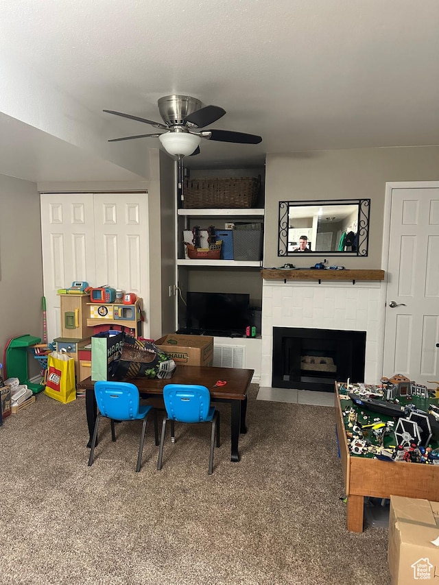 1704 N Hickory Ln W, Provo, UT 84604 - rec room with carpet flooring, a ceiling fan, and a tiled fireplace