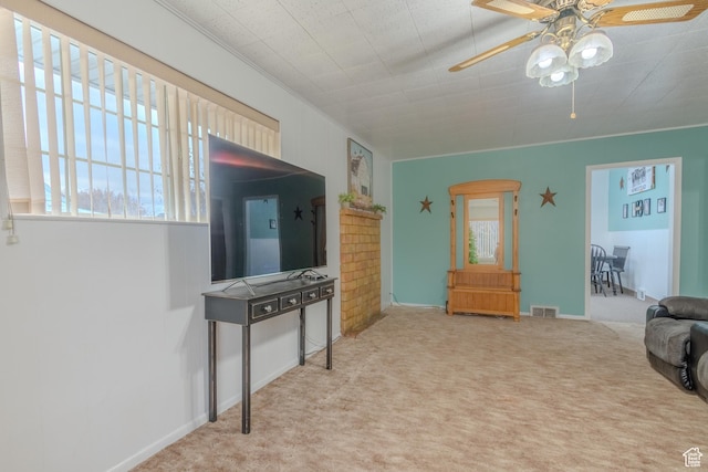 906 S Main St, Grace, ID 83241 - living area with plenty of natural light, a ceiling fan, and carpet floors
