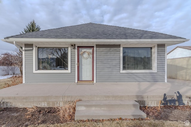 906 S Main St, Grace, ID 83241 - bungalow with a shingled roof and a patio area