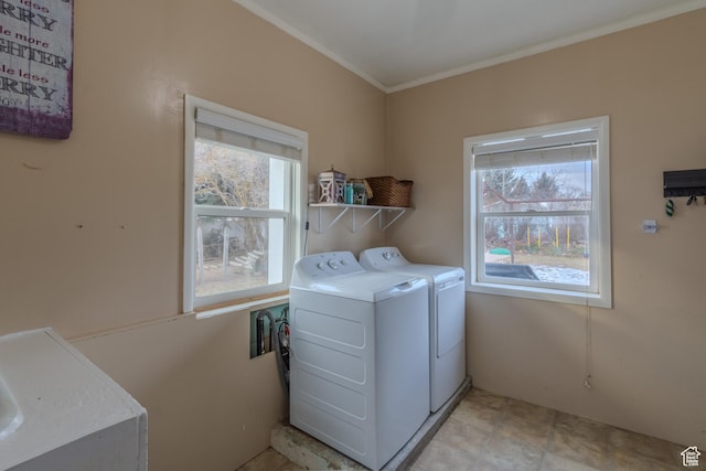 906 S Main St, Grace, ID 83241 - laundry area featuring washing machine and dryer, plenty of natural light, and ornamental molding
