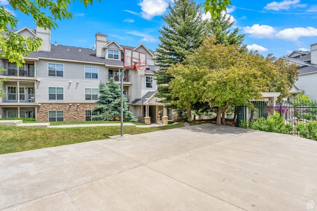 900 Bitner Rd Unit K25, Park City, UT 84098 - view of front facade with basketball court and a front yard