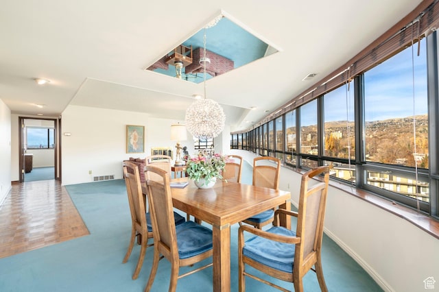 426 S 1000 E Unit 600, Salt Lake City, UT 84102 - dining room featuring a chandelier and healthy amount of natural light