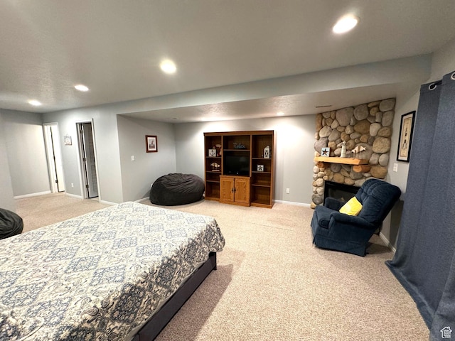 890 N Newberg Pl Unit 3, Garden City, UT 84028 - bedroom with light colored carpet, a fireplace, and recessed lighting