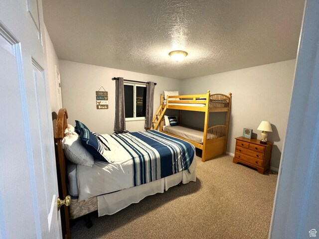 890 N Newberg Pl Unit 3, Garden City, UT 84028 - carpeted bedroom with a textured ceiling