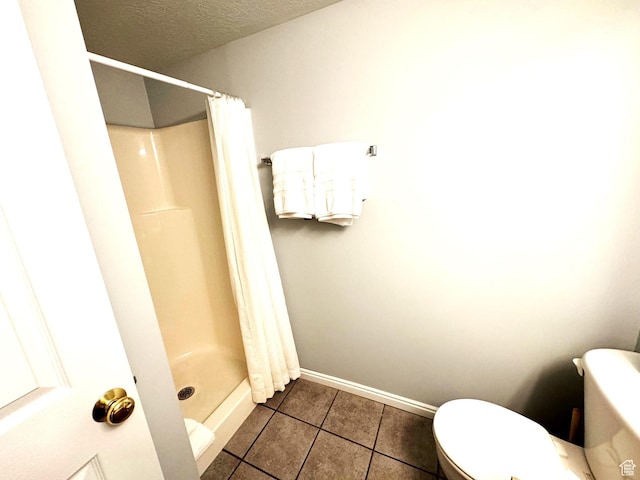 890 N Newberg Pl Unit 3, Garden City, UT 84028 - full bath with tile patterned flooring, a shower stall, and a textured ceiling