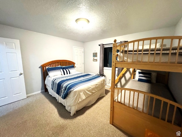 890 N Newberg Pl Unit 3, Garden City, UT 84028 - bedroom featuring carpet floors and a textured ceiling