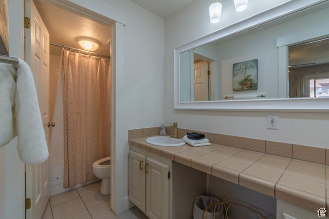860 S Village Rd Unit Y8, St George, UT 84770 - bathroom with tile patterned floors, vanity, toilet, and a shower with shower curtain