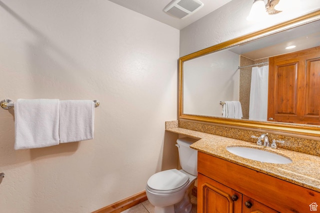bathroom featuring tile patterned floors, vanity, toilet, and a shower with shower curtain