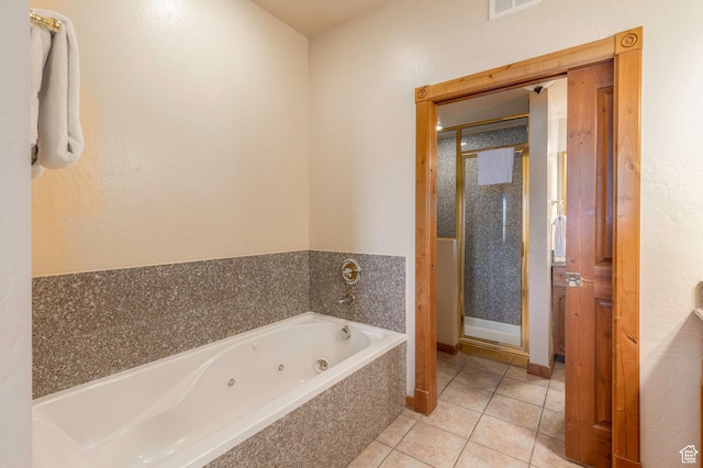 bathroom featuring tile patterned floors and plus walk in shower