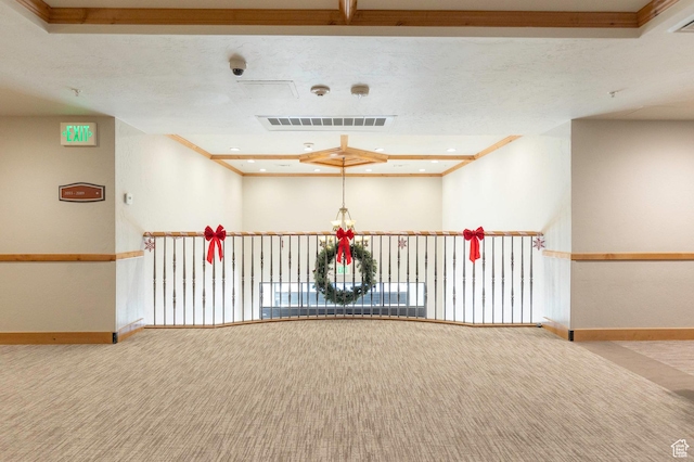 interior space featuring carpet and a textured ceiling
