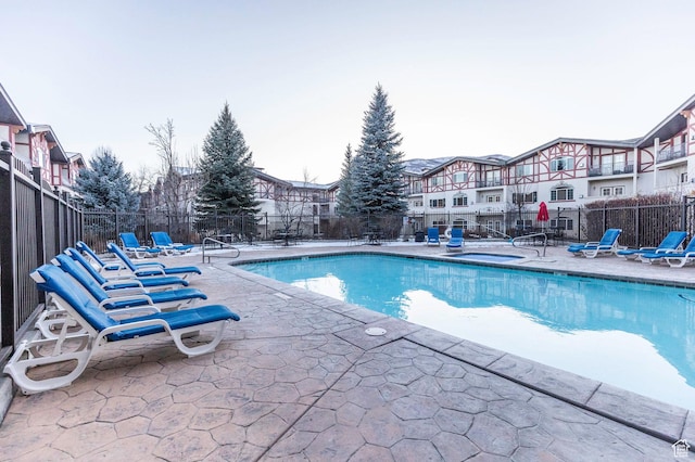 view of swimming pool with a patio