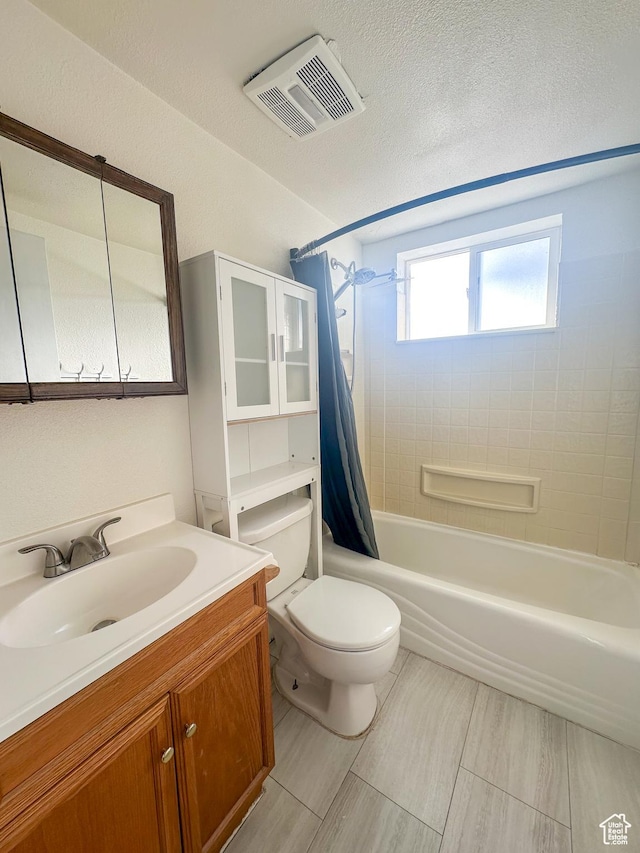 full bathroom featuring vanity, toilet, and shower / tub combo with curtain