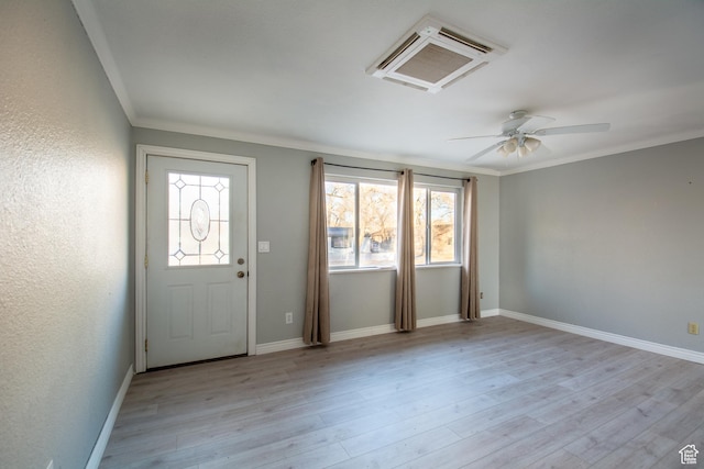 entryway featuring light hardwood / wood-style flooring, a wealth of natural light, ornamental molding, and ceiling fan