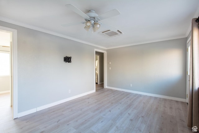 unfurnished room featuring ceiling fan, a healthy amount of sunlight, crown molding, and light hardwood / wood-style flooring
