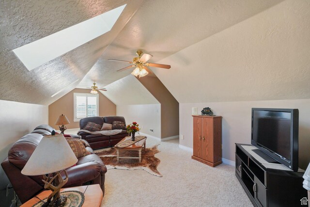2594 W 1800 N, Farr West, UT 84404 - living room with a textured ceiling, ceiling fan, light colored carpet, and lofted ceiling with skylight
