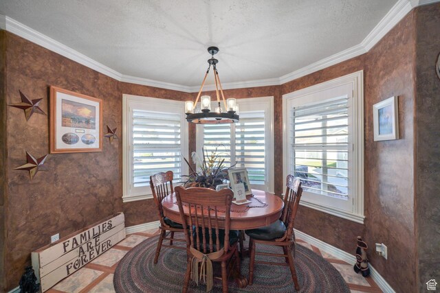 2594 W 1800 N, Farr West, UT 84404 - dining space with tile patterned flooring, ornamental molding, a textured ceiling, and an inviting chandelier