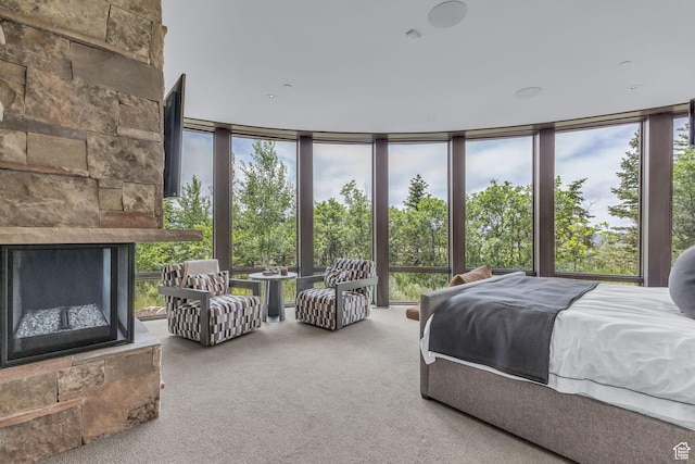 8544 N Promontory Ranch Rd, Park City, UT 84098 - carpeted bedroom featuring multiple windows, a wall of windows, and a stone fireplace