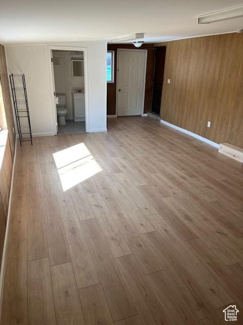 479 N Valeria Dr E, Layton, UT 84041 - unfurnished bedroom with baseboards, wood finished floors, and wood walls