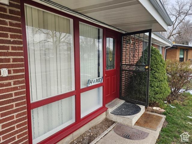 479 N Valeria Dr E, Layton, UT 84041 - view of exterior entry featuring brick siding
