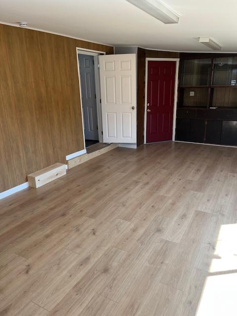 479 N Valeria Dr E, Layton, UT 84041 - unfurnished room with wood finished floors and wood walls