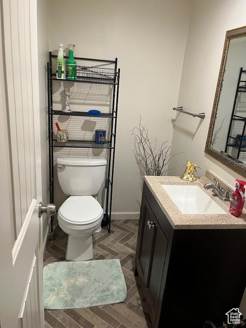 479 N Valeria Dr E, Layton, UT 84041 - bathroom with baseboards, toilet, and vanity