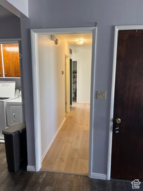 479 N Valeria Dr E, Layton, UT 84041 - hall featuring washer and dryer, visible vents, wood finished floors, and baseboards
