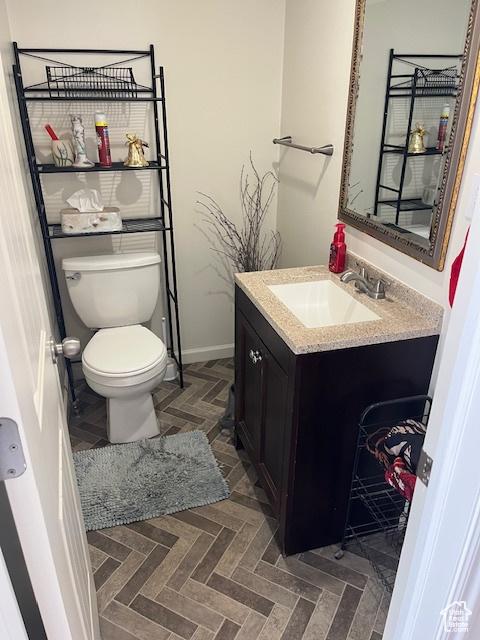 479 N Valeria Dr E, Layton, UT 84041 - half bath featuring toilet, vanity, and baseboards