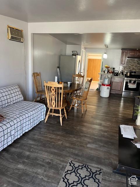 479 N Valeria Dr E, Layton, UT 84041 - living room with a wall mounted air conditioner and dark wood-type flooring