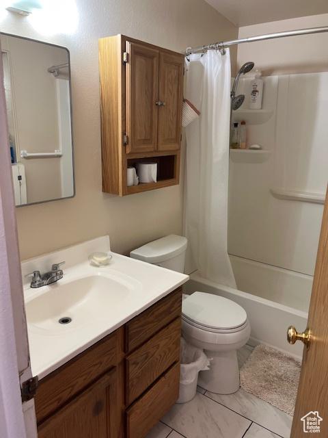 479 N Valeria Dr E, Layton, UT 84041 - full bath with tile patterned flooring, shower / bath combination with curtain, toilet, and vanity