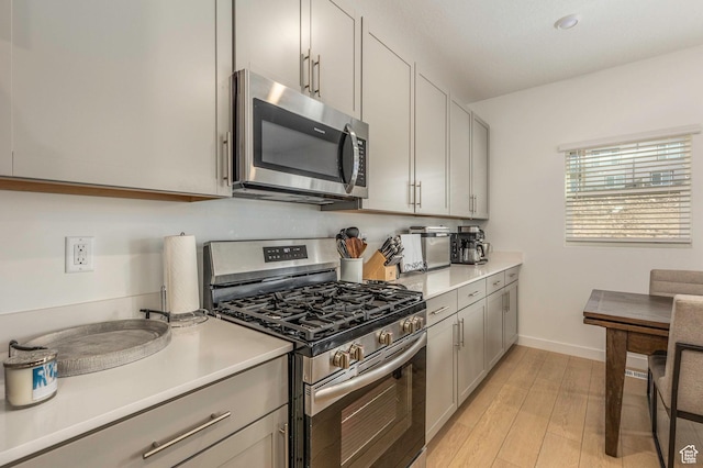2278 N Canal View Ln, Heber City, UT 84032 - kitchen featuring appliances with stainless steel finishes and light hardwood / wood-style flooring
