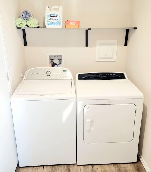 573 S Aspen Dr, Garden City, UT 84028 - laundry room with separate washer and dryer and light hardwood / wood-style flooring