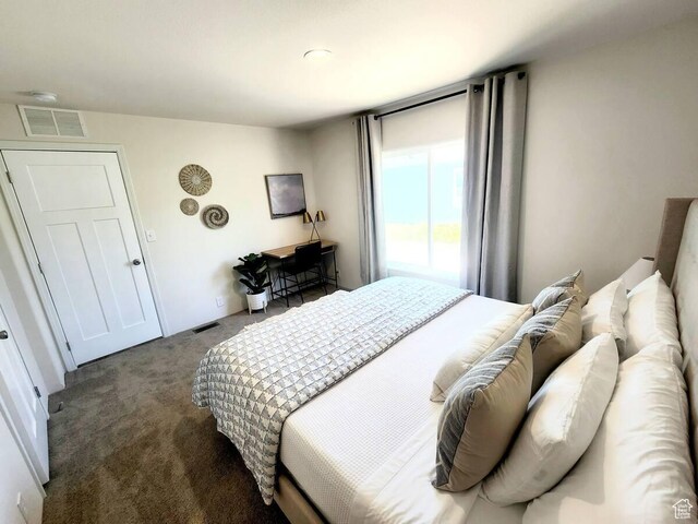 573 S Aspen Dr, Garden City, UT 84028 - bedroom featuring dark colored carpet