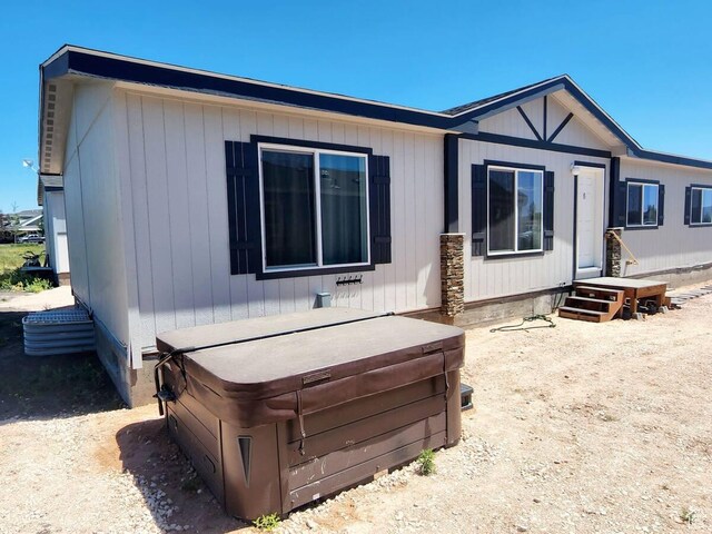 573 S Aspen Dr, Garden City, UT 84028 - rear view of house with a hot tub
