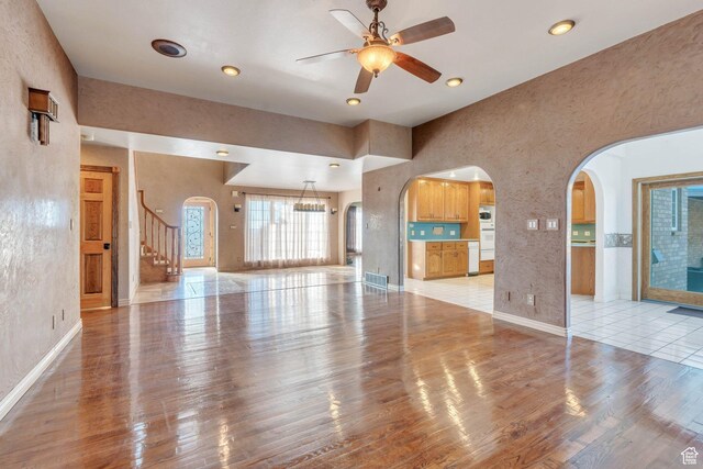 1402 Shepherd Dr, Wellington, UT 84542 - unfurnished living room featuring light hardwood / wood-style floors and ceiling fan